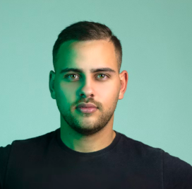 Man with trimmed beard and black shirt