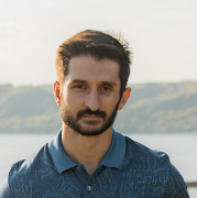 Bearded man by water